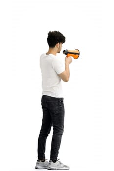 A man, on a white background, in full height, with a megaphone.