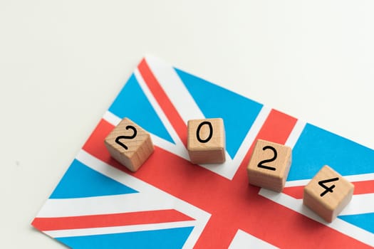 2024, United Kingdom, United Kingdom flag with date block, Concept, Important events for UK in the new year, election, economy, social activities, central bank, UK foreign policy. High quality photo