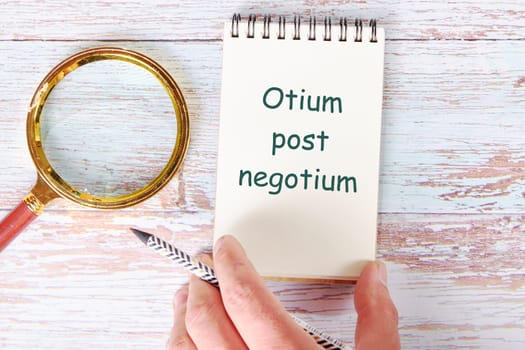 Otium post negotium It is translated from Latin as, Rest after the case It is written in a clean open notebook