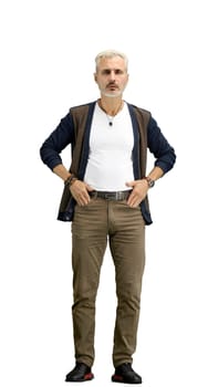 A man, full-length, on a white background, hands on hips.