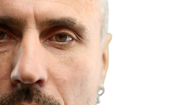 Man's eyes, close-up, on a white background.