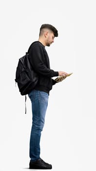 A man, full-length, on a white background, with a backpack.