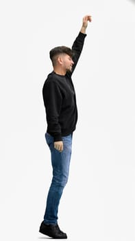 A man, full-length, on a white background, jumps.