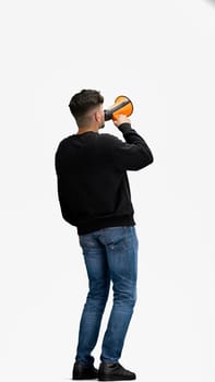 A man, full-length, on a white background, with a megaphone.