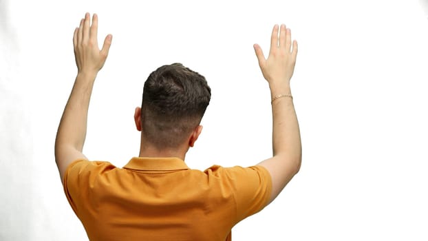 A man, close-up, on a white background, waving his arms.