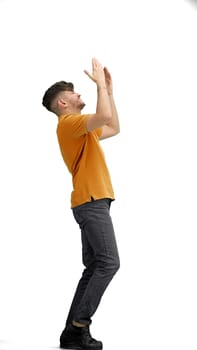A man, full-length, on a white background, spreads his arms.