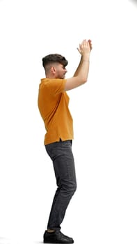 A man, full-length, on a white background, claps.