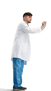 Doctor, full-length, on a white background, with a stethoscope.