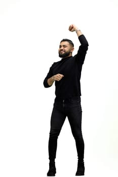 A man, full-length, on a white background, raised his hand.