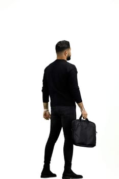 A man, full-length, on a white background, with a briefcase.