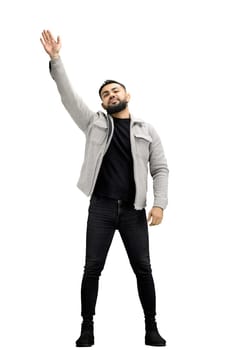 A man, full-length, on a white background, waving his hand.