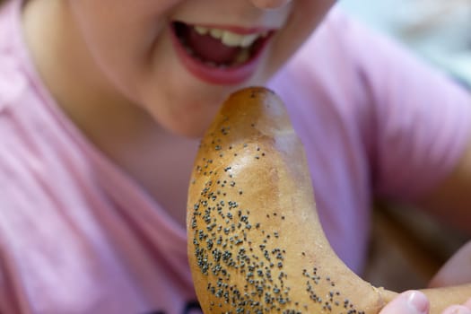 Young girl - child eating candy and sweets. Detail of face and mouth. Concept for healthy lifestyle - healthy - unhealthy sweet food and sugar.