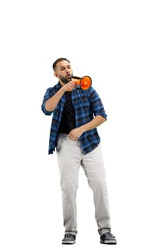 A man, full-length, on a white background, with a megaphone.