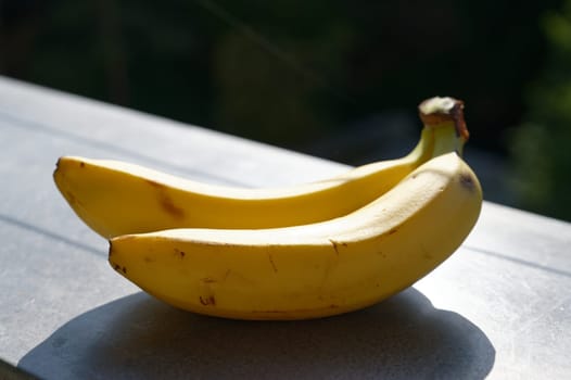 Beautiful fresh yellow banana on the table. Healthy food - fruit for a snack.