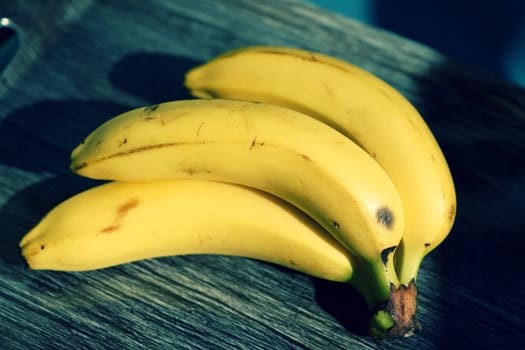 Beautiful fresh yellow banana on the table. Healthy food - fruit for a snack.