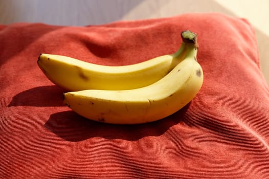 Beautiful fresh yellow banana on the table. Healthy food - fruit for a snack.