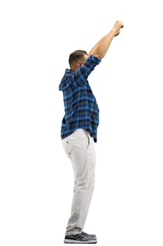 A man, full-length, on a white background, waving his arms.