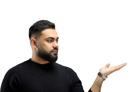 A man, close-up, on a white background, points to the side.