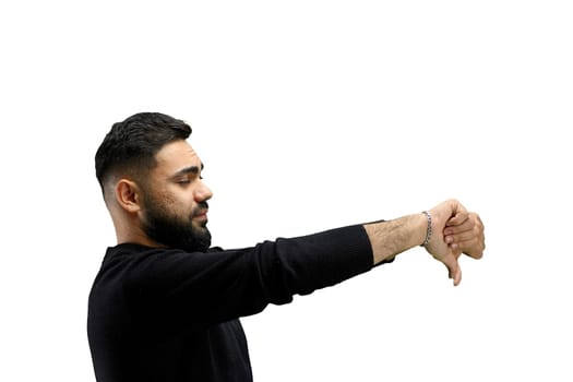 A man, close-up, on a white background, shows his thumbs down.