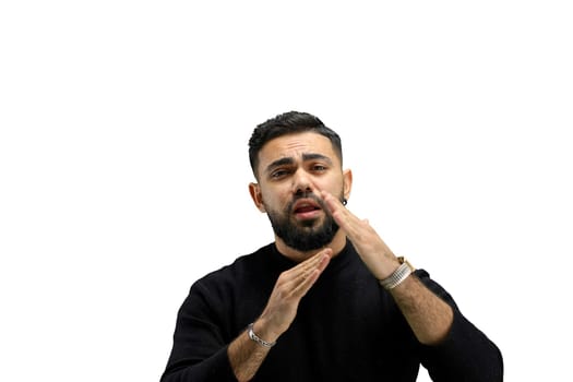 A man, close-up, on a white background, shows a pause sign.