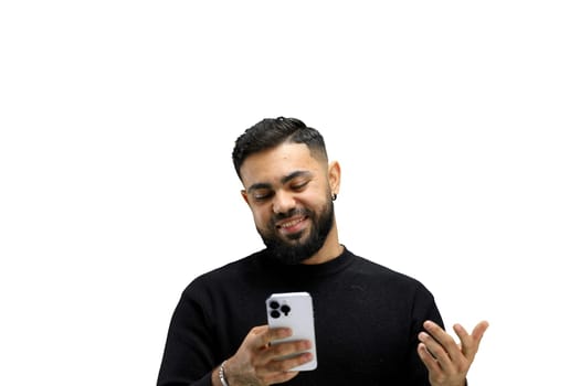 Man, close-up, on a white background, using a phone.