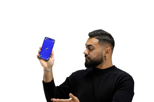 A man, close-up, on a white background, shows a phone.