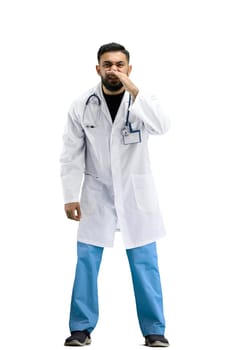 The doctor, in full height, on a white background, tells a secret.
