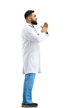 The doctor, in full height, on a white background, shows a pause sign.