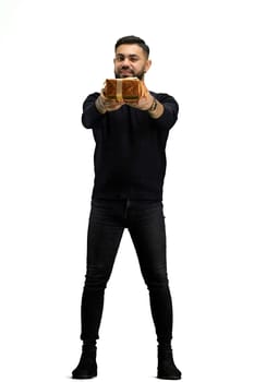 A man, full-length, on a white background, with a gift.