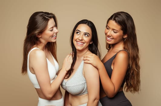 Cheerful young spanish, arab and european women in different underwear enjoy natural beauty, free time, lifestyle, isolated on beige background, studio. Hair, health care, freshness, skin types