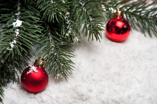 fir tree branches and decorations in Christmas and New Year concept. closeup at decoration balls