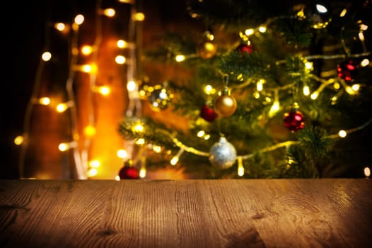 wooden table with fir tree and decorations in the background. Christmas and New Year concept