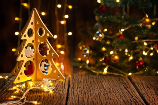 wooden table with fir tree and decorations in the background. Christmas and New Year concept