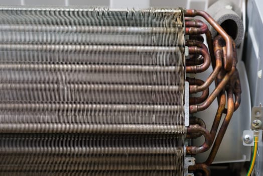 Air conditioning service, repair & maintenance concept. closeup at an indoor unit coil.