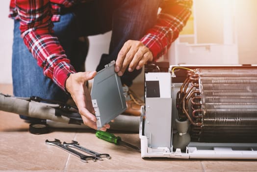 Air conditioning service, repair & maintenance concept. closeup at an indoor unit coil.