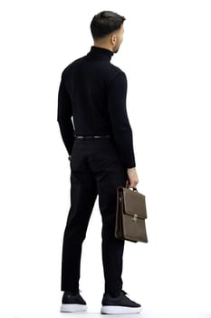 A man, on a white background, in full height, with a briefcase.