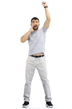 A man, on a white background, in full height, rejoices.