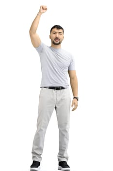 A man, on a white background, in full height, rejoices.
