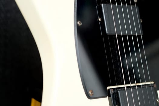 Electric guitar on the background of a guitar amplifier. Musical instrument.