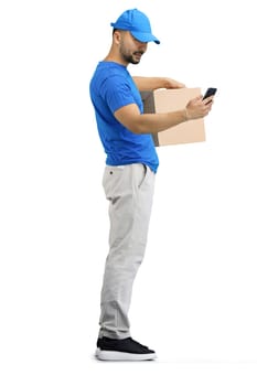 The deliveryman, in full height, on a white background, with a box and a phone.