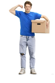 The deliveryman, in full height, on a white background, with a box, shows strength.