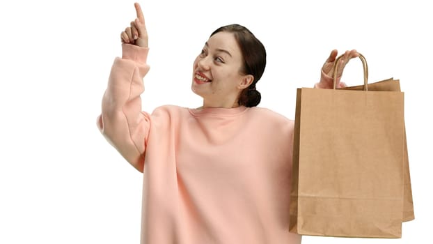 Woman, close-up, on a white background, with bags.