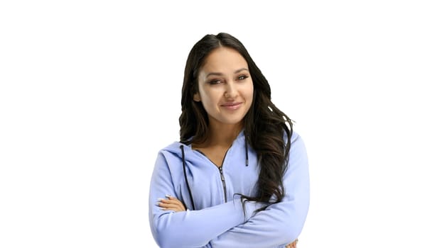 A woman, close-up, on a white background, crossed her arms.