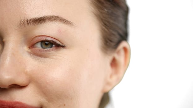 Woman's eyes, close-up, on a white background.