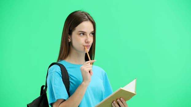 Woman, close-up, on a green background, with a backpack.