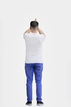 A man, full-length, on a white background, claps.