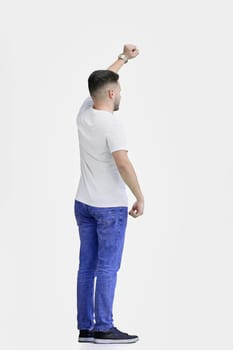 A man, full-length, on a white background, rejoices.
