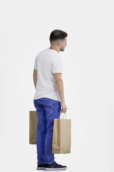 A man, full-length, on a white background, with bags.