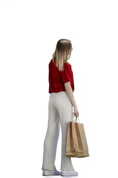 A woman, full-length, on a white background, with bags.