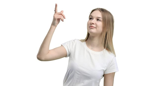 Woman, close-up, on a white background, pointing up.